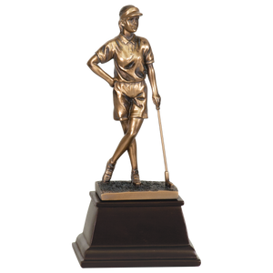 Medium sized bronze golf trophy on a tapered square dark wood base. The bronze female golfer is standing with her legs grossed and one hand on her hip and the other hand leaning on a golf club. She is staring off into the distance with a visor on.