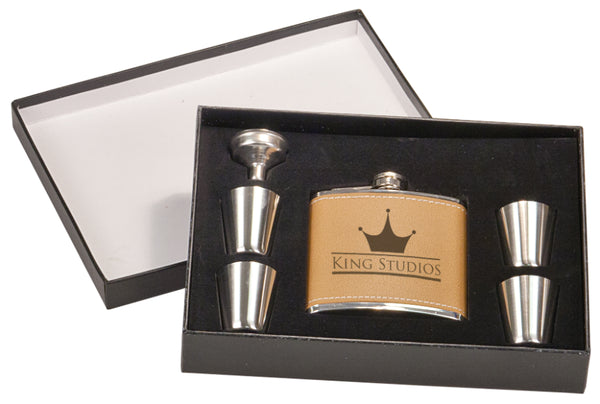Personalized tan faux leather flask and four shot glasses.