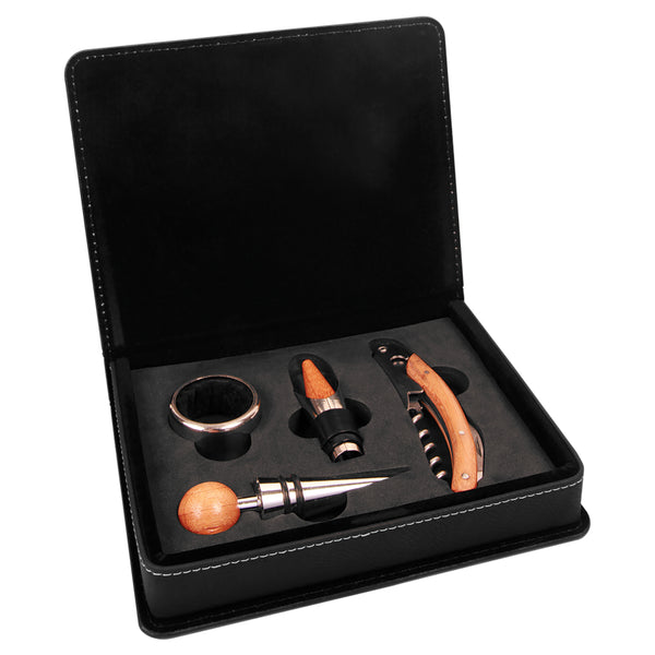 Black engraved leatherette box with a set of four wine tools displayed in foam.