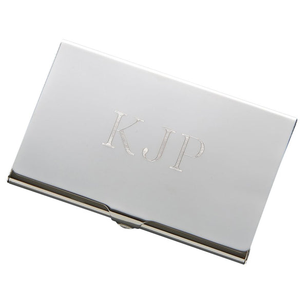 Sleek shiny silver business card holder engraved with monogram in the middle.
