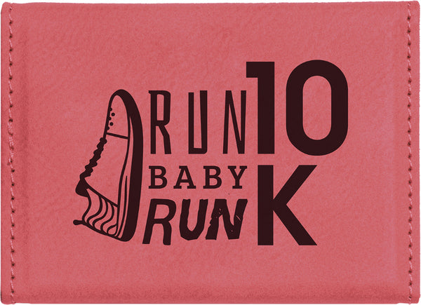 Pink leatherette magnetic business card holder with a company logo engraved in black.