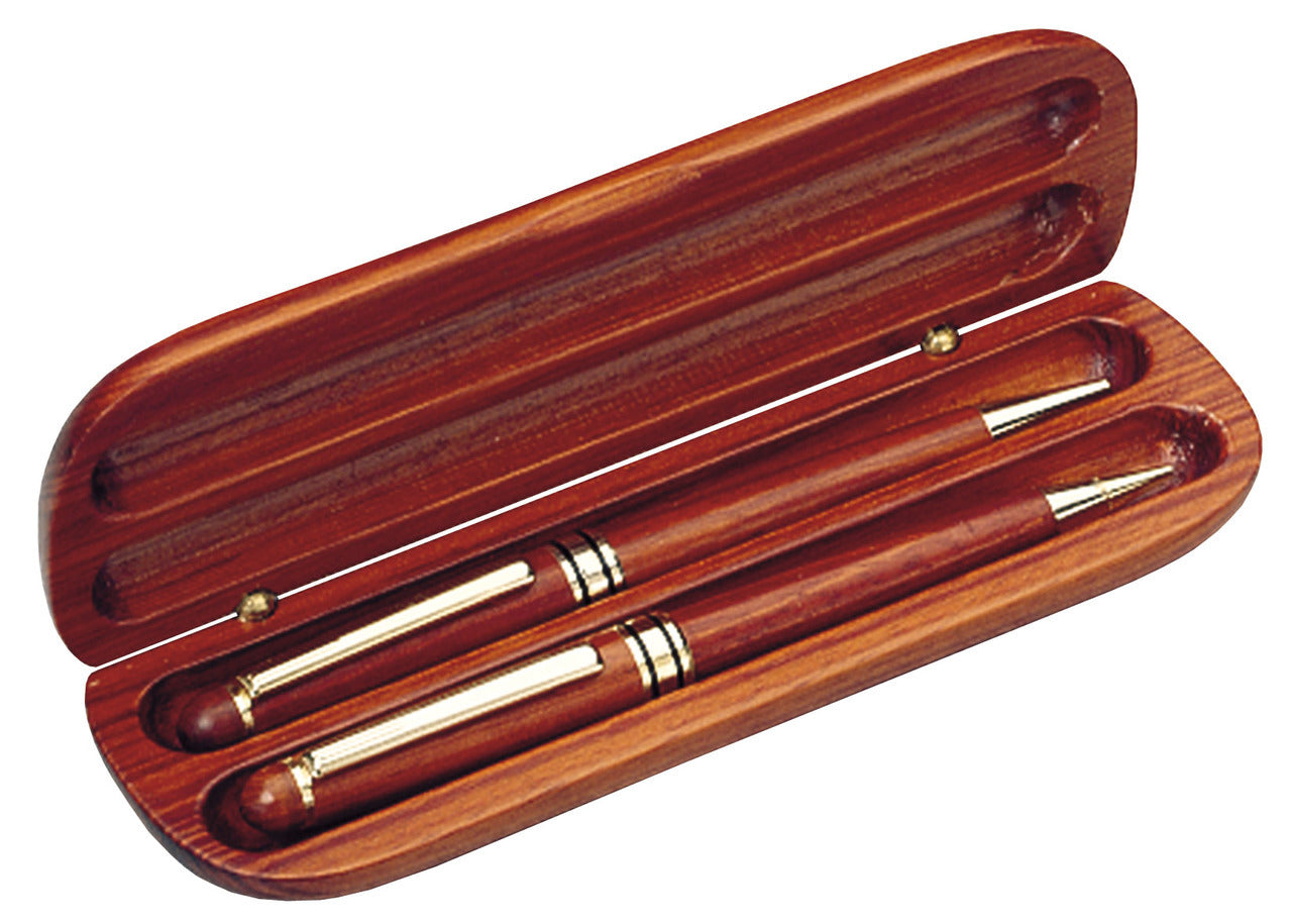 Rosewood pen and penceil set in a slender oval rosewood case. Pen and pencil feature shiny gold tips and and clips.