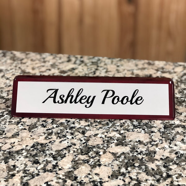 Custom engraved rosewood desk name plate.
