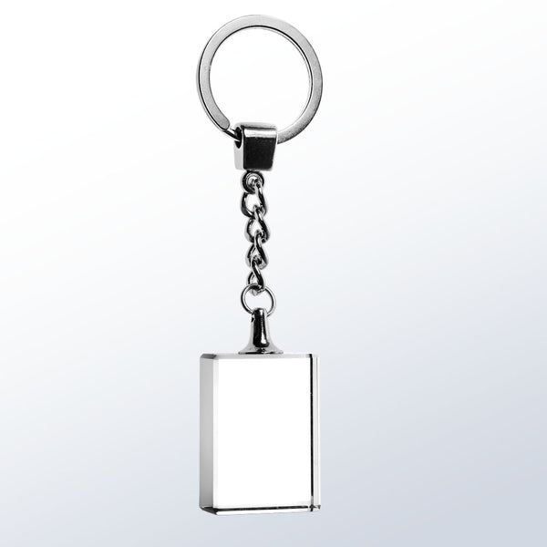 Rectangles shaped clear crystal keychain with silver chain and key ring. The crystal keychain is engraved with a name in a frosty white color.