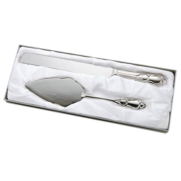 Shiny silver metal cake server and knife set featuring a thick ornate design at the bottom of the handles. The cake server is engraved with the bride and groom's names and wedding date.