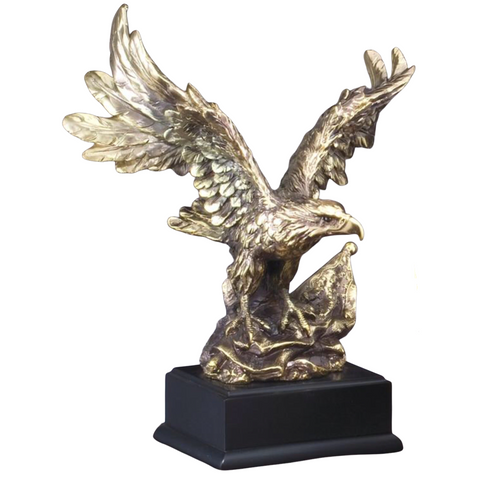 Small Gold Eagle Resin sitting on American Flag