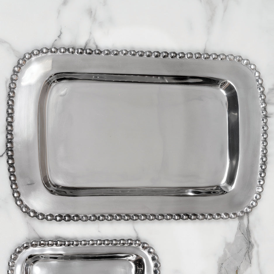 Shiny silver large rectangle shaped shaped tray with a beaded edge. Center of the tray can be engraved with a special message.