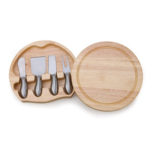 Round light wood cutting board that swings around and opens to reveal four silver stainless steel cheese tools in holders. 