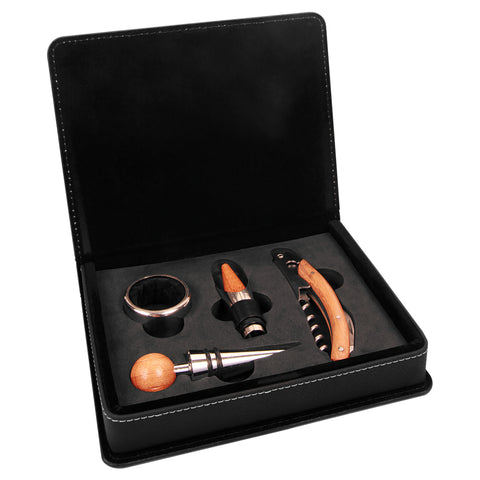 Black engraved leatherette box with a set of four wine tools displayed in foam. 