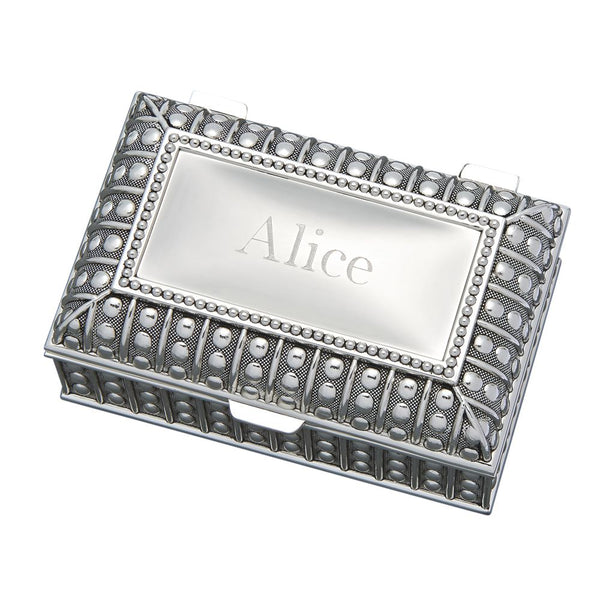 Rectangle shaped jewelry box feauturing a beaded design throughout. The top is flat and is engraved with a name.