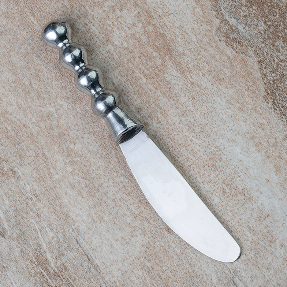Small silver cheese knife with a beaded handle.
