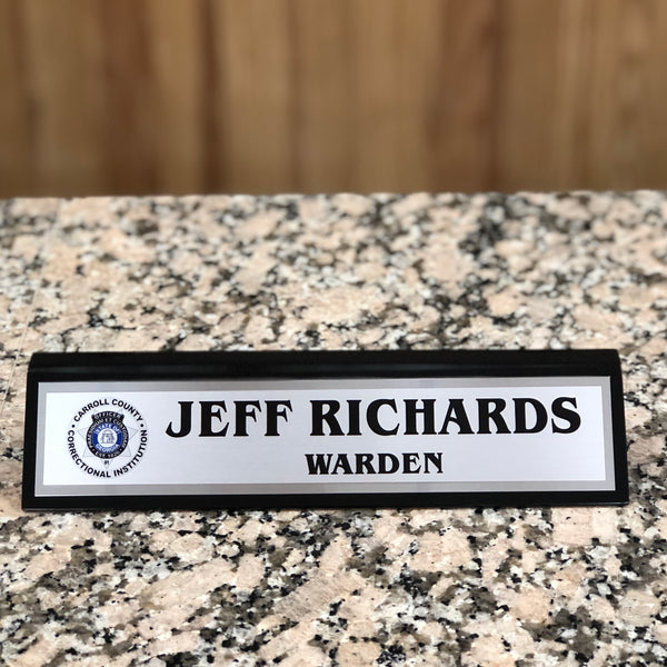 Personalized black and silver desk name plate.