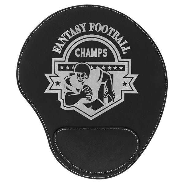 Black leatherette mouse pad with a pad at the bottom to rest your wrist. The mouse pad is engraved with a large silver company logo.