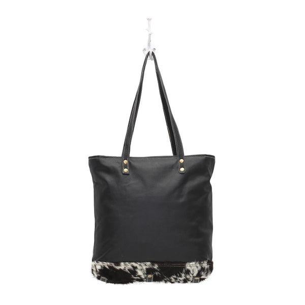 black and white cowhide purse