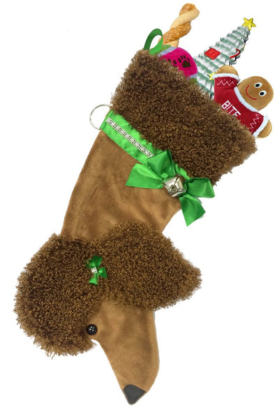 Brown poodle breed dog Christmas stocking featuring a curly brown head and ear, a green bow on the ear, and a green and silver rhinestone bow and bell attached to the collar.