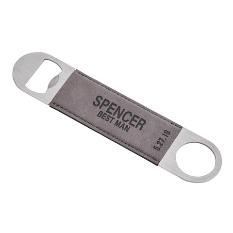 Metal bottle opener with grey leatherette body that is enggraved with a "Best Man" and a name and date in black letters. 