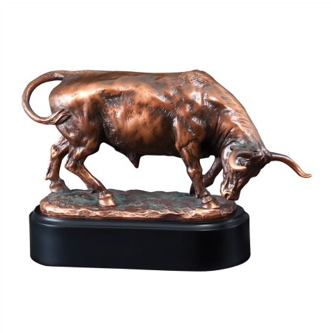 Rodeo trophy featuring a black oval base with a large bronze bull on top. The bull has its horns and head pointed downward with its left foot up as if he is about to charge.
