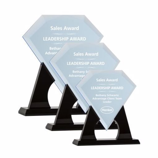 Small, medium and large diamond shaped clear engraved acrylic awards sitting on black acrylic stands.