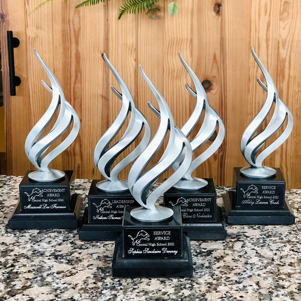 silver flame awards on marble base