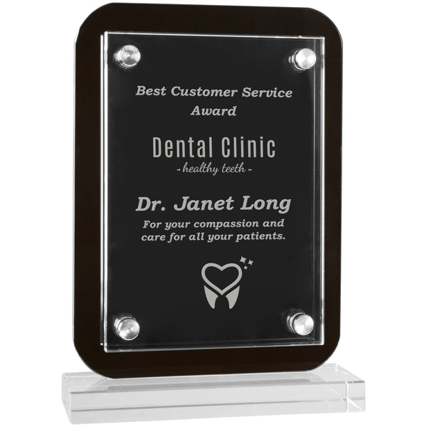 Standing black glass plaque featuring a rectangle shape and rounded edges. The base is clear glass rectangle shaped. There is a clear piece of engraved acrylic overlaid on the glass plaque that is secured by magnets on all four corners.