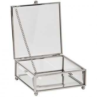 Rectangle shaped glass jewelry box with silver edges and corners and round feet.