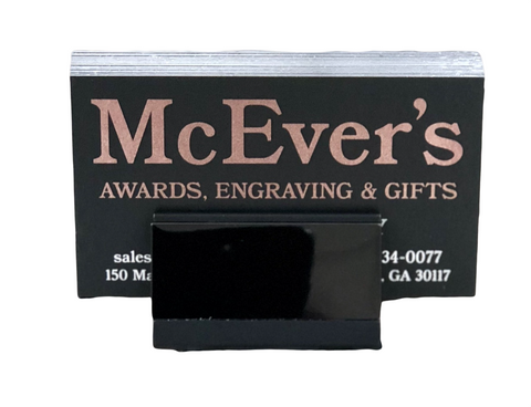 Sleek and slender gunmetal business card holder for table top. Gunmetal strip on the front can be engraved.