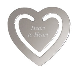 Silver metal heart shaped bookmark. Bookmark is engraved in the center with a special message.