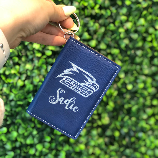 blue and silver engraved keychain wallet