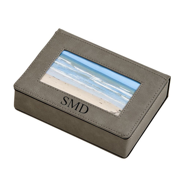 Grey leatherette keepsake box with photo insert on the lid and monogrammed beneath the photo. Engraving is black.