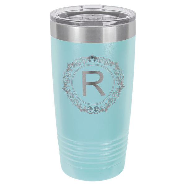 Light blue engraved tumbler with a skinny ribbed bottom to fit in a cup holder. Comes with a clear plastic lid.