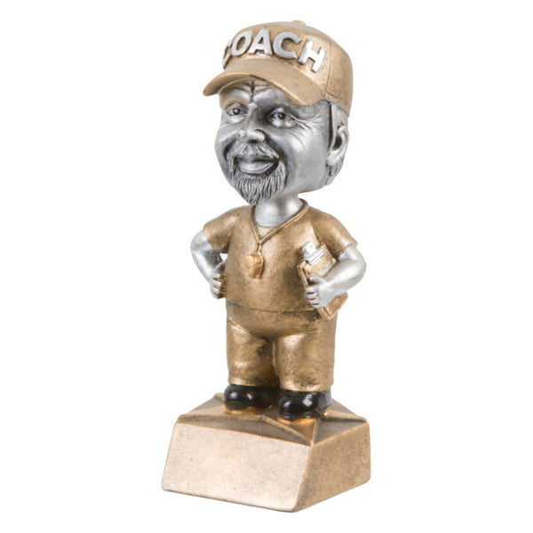 Male coach bobble head trophy featuring a gold base, gold outfit, and silver coach's head with a beard. Coach has on a gold hat that reads "COACH" in silver letters.
