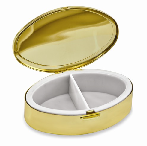 Oval shaped pill box featuring two plastic compartments inside. The outside cover is brushed silver and gold metal.