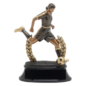 Black and gold soccer trophy featuring a black oval shaped base, a wreath, and a female soccer player with her leg extended as if she is about to kick a soccer ball.
