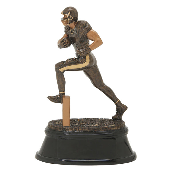 Black and bronze football trophy featuring a black oval base and a football player running with his leg up and football tucked in one arm.
