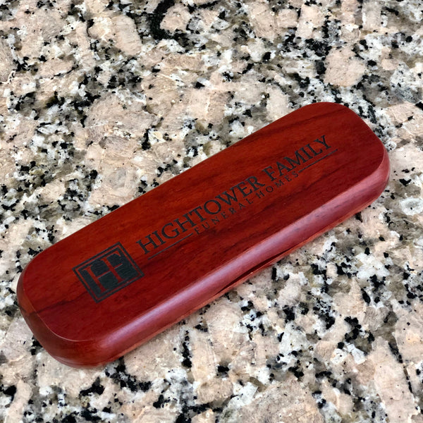 Engraved rosewood pen case.
