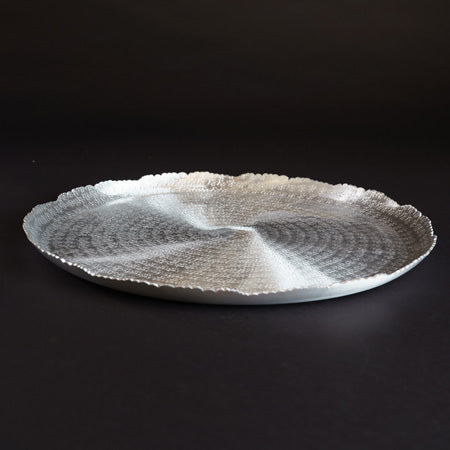 round silver hammered tray with distressed edge