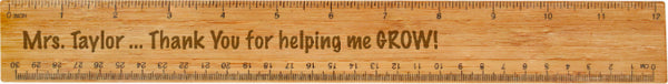 Wood burned wooden ruler that reads "Mrs Taylor... Thank You for helping me GROW!" in the center.