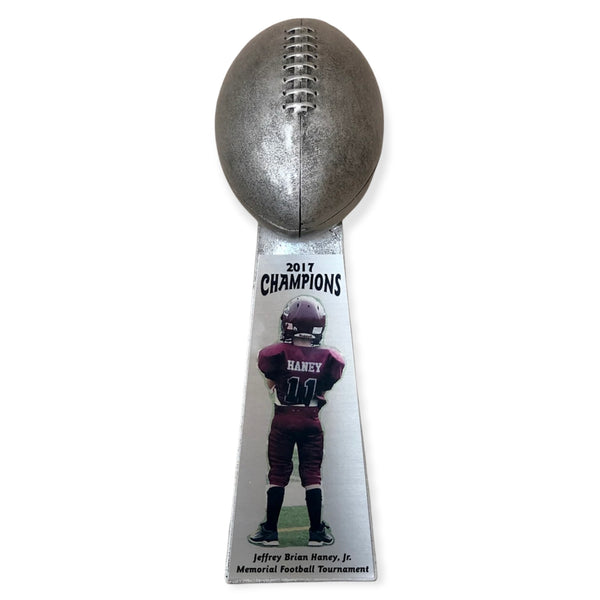 silver football trophy with picture