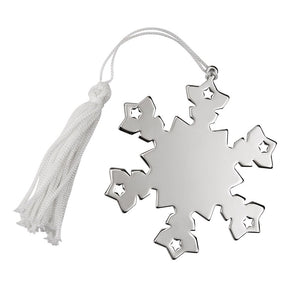 Shiny silver nowflake shaped ornament with a white string and tassel for hanging. The ornament is flat and the center can be engraved.