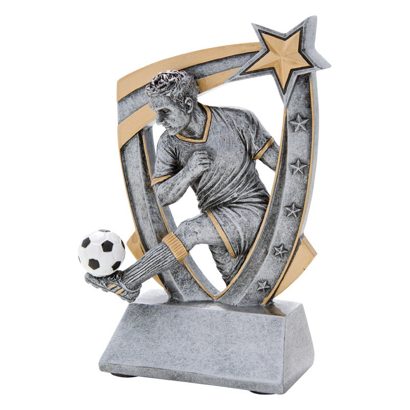 Shield shaped soccer trophy featuring a silver design and a male soccer player with his leg extended and a soccer ball resting on his foot.