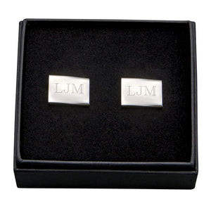 Rectangle shaped silver stainless steel cuff links engraved with a monogram.