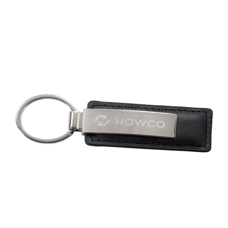 Rectangle shaped skinny black leatherette keychain featuring a shiny silver key ring and chrome strip that can be engraved.
